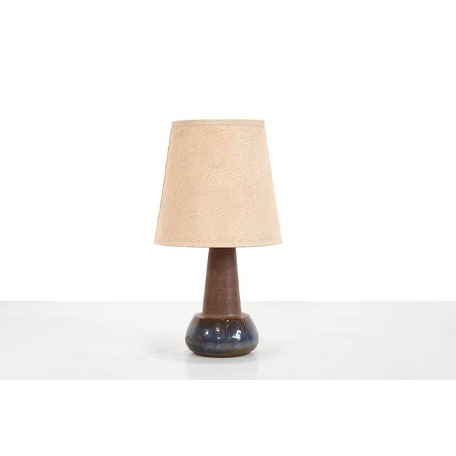 Beautiful Danish design ceramic table lamp with jute upholstered shade. This piece is attributed to the mentioned...