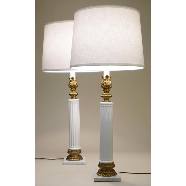A bold and impressive matched pair of vintage Neoclassical Modern Porcelain, Brass & Marble Composite-stylized Column...