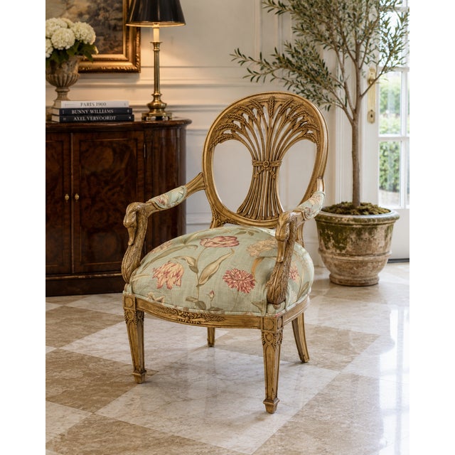 Striking vintage Italian-style Neoclassical armchair featuring an intricately carved giltwood frame with sculptural bird-...