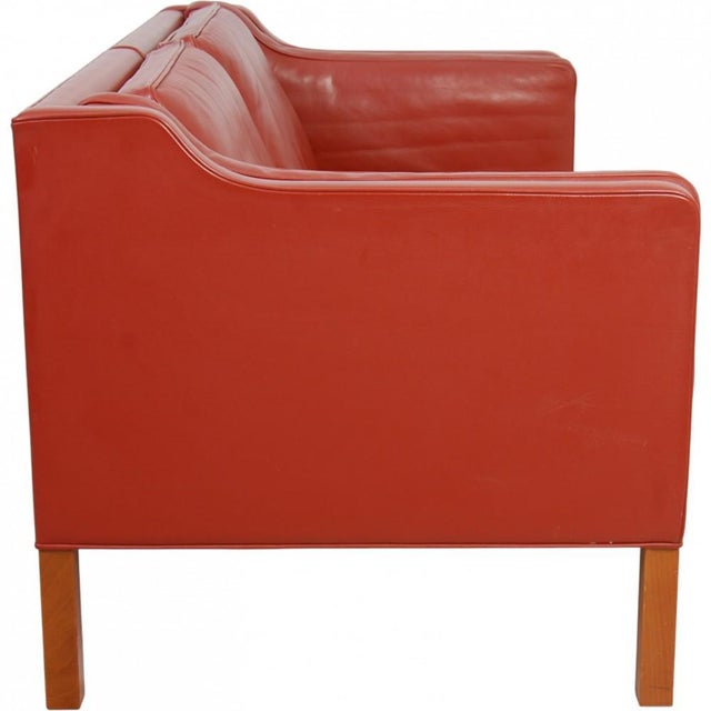 Børge Mogensen 2212 2.seater sofa upholstered in original red leather and with legs of mahogany. The sofa is from around...