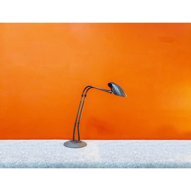 Metal table lamp with plastic details. Tango model Designer Stephan Copeland Artiluce manufacturer 1989 This piece has an...