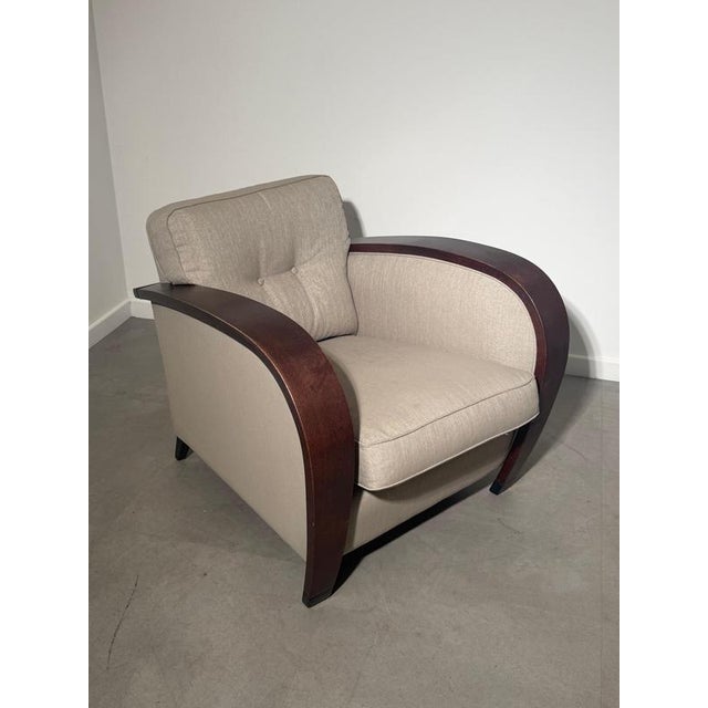 Elegant vintage Art Deco lounge chair by Bench, featuring beautifully curved dark wooden armrests and a refined beige...