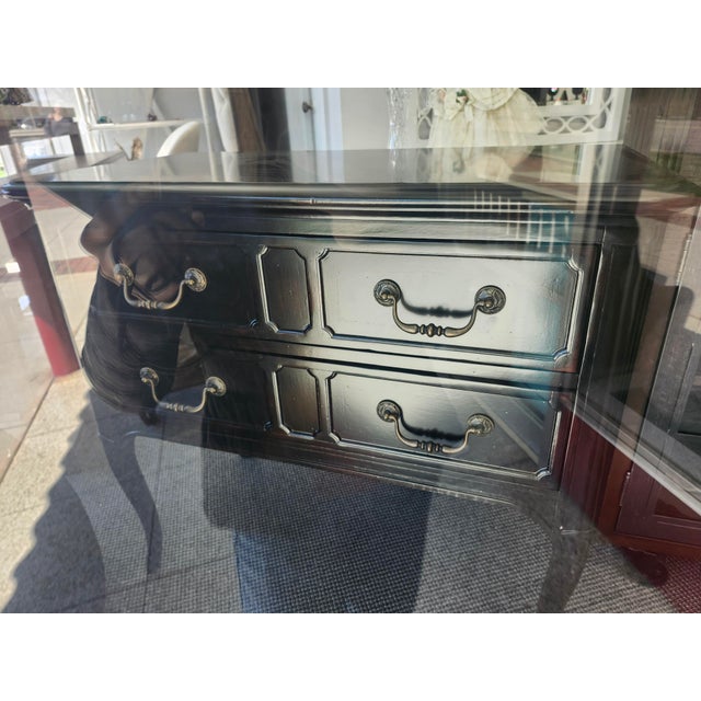 Imagine a coastal breeze drifting through aged oak trees adorned with Spanish moss, gently ruffling the magnolias...