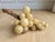 Impressively large mid-century alabaster grape cluster mounted on a twisted natural grapevine stem. The spheres have...