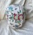 Vintage Garden Floral Ginger Jar with Birds, Butterflies and Fruit with a raised relief Off white with blues, greens and...
