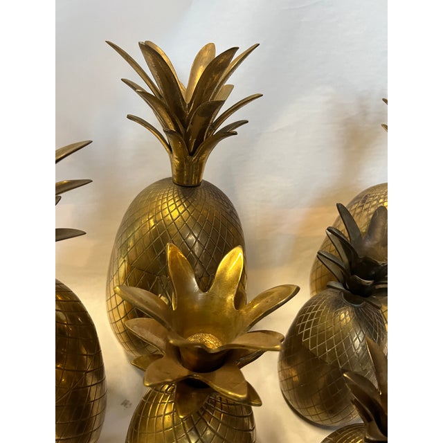 This is a beautiful set of brass pineapple catchall boxes. They open up with a lid at the top of the pineapple and have...