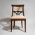 Biedermeier side chair with an upholstered seat and a stained beechwood frame. The unusually designed backrest features...