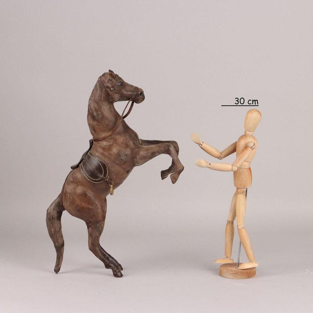 Prancing horse covered in leather. This piece is attributed to the mentioned designer/maker. It has no attribution mark...