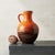 This large Jasba ceramic vase from the 1970s captivates the eye with its two-tone glaze, where a speckled, volcanic orange...