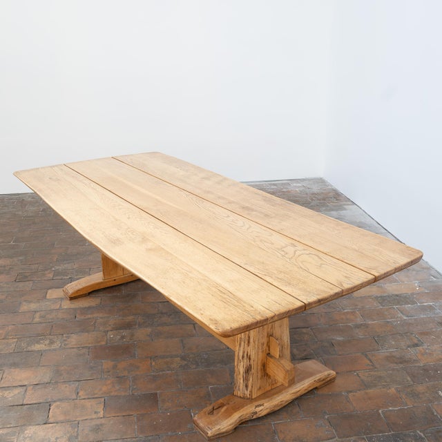 A beautiful 1970s solid oak table with a design that is both rustic and very contemporary. Its wide, rectangular slatted...