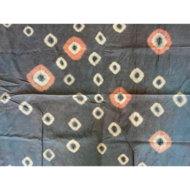 Striking "pelangi" tie-dyed textile from Toraja Land, South Sulawesi. We added a linen border, double backed on both ends....