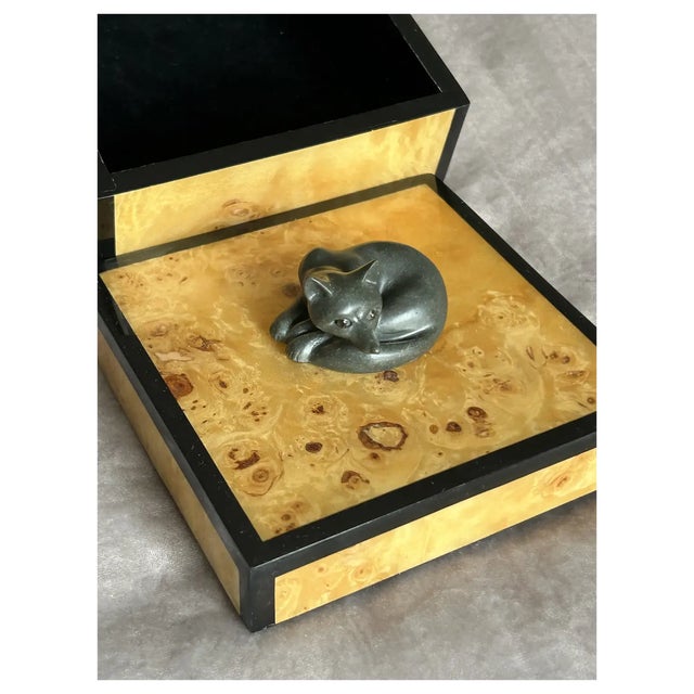 Little Fox is hand carved natural, dark, charcoal grey, almost black, Soapstone and signed by the artist. I set her eyes...