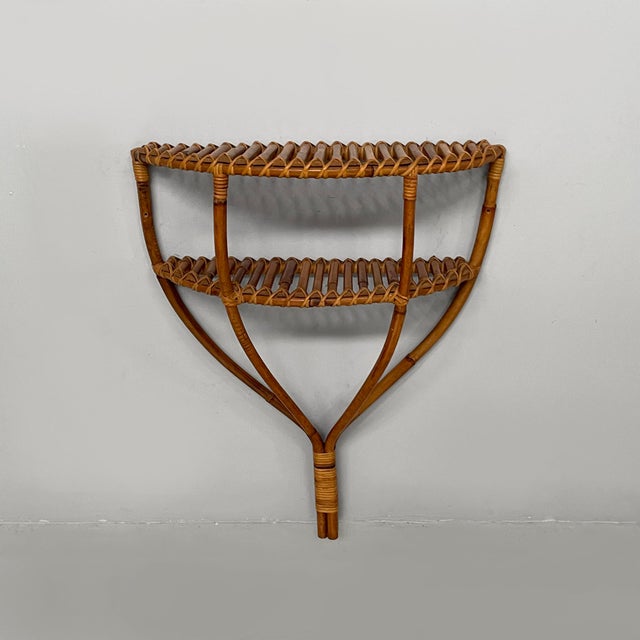 Italian mid-century modern wall console in rattan, 1960s Wall-mounted console table made entirely of finely woven rattan....
