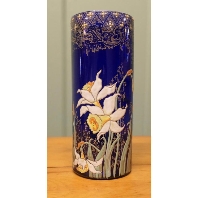 A Stunning Cobalt Blue Enamelled Vase with Daffodils The vase is superb piece overlaid with gold and colourful daffodils,...
