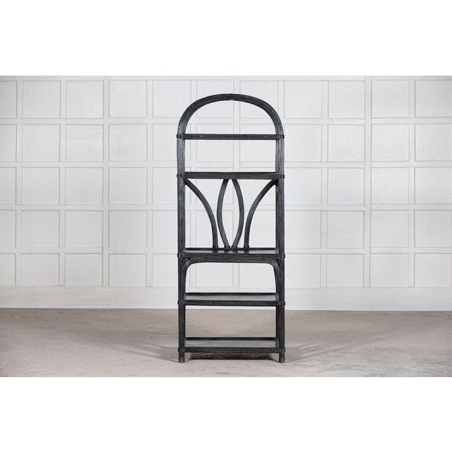 Circa 1950. Large black French fruitwood reeded etager. W75 x D48 x H190cm.