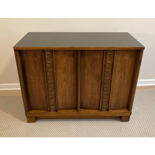 With its alternating geometric detail, this mid-20th century bar by Consolidated Furniture Company of Lenoir, North...