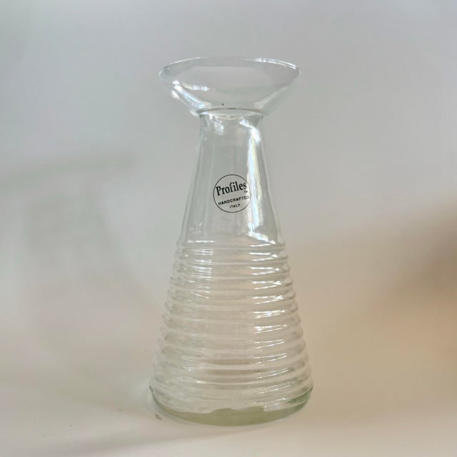 A beautifully vintage clear glass decanter by Profiles, handcrafted in Italy. Designed with a refined ribbed texture and...