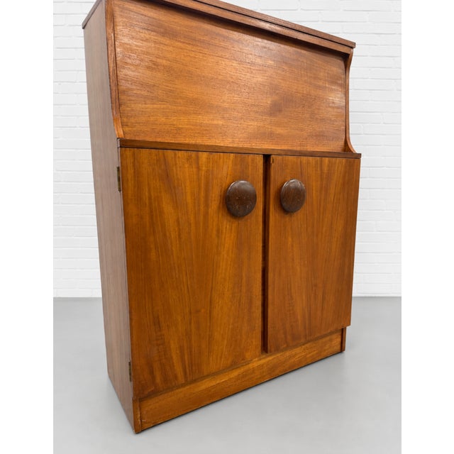 Mid Century Modern Teak Bar Cabinet | Mirrored Home Bar With Drop-Down Serving Surface, C. 1960’s For Sale - Image 9 of 14
