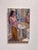 The painting depicts a solitary figure standing before a bathroom mirror, enveloped in soft, muted tones that convey a...
