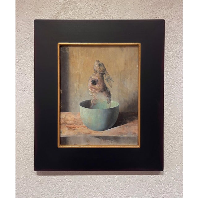 The artwork presents a surreal composition of a figure resembling a fish or a human form, emerging from a softly rounded...