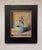 The artwork presents a surreal composition of a figure resembling a fish or a human form, emerging from a softly rounded...
