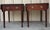 Bring timeless traditional style to your home with this handsome matched pair of Bombay Company mahogany side tables....