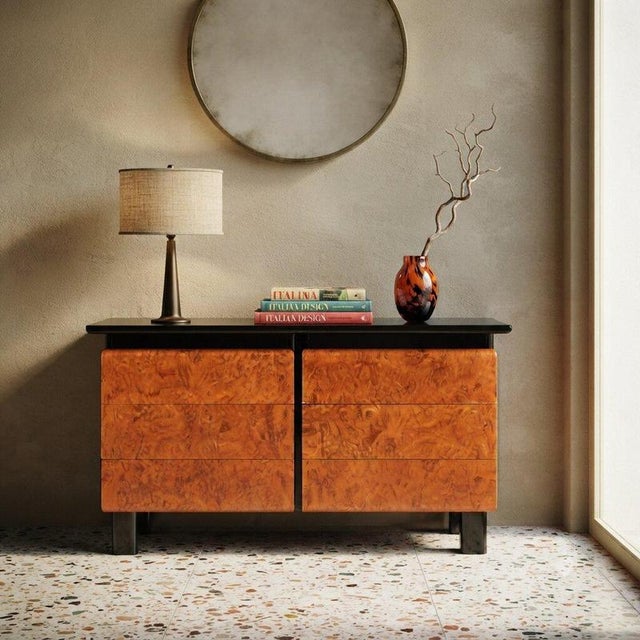 1980s storage unit crafted in lacquered wood, featuring a sleek and modern design. The drawer fronts are made of burl,...