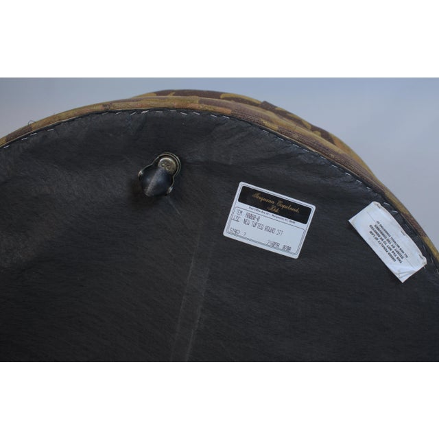 A richly detailed round ottoman by Ferguson Copeland, known for their finely crafted, luxury furnishings. This generously...