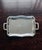 Large silver-plated metal serving tray with a scalloped edge and two molded side handles. Beautiful overall shine, with...