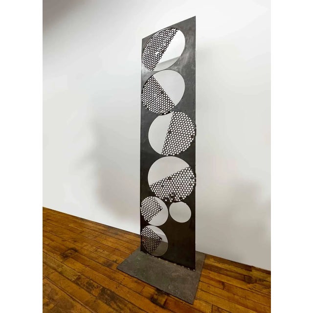 Vintage large metal abstract sculpture. Welded steel and iron construction. This sculpture has some movement to the...