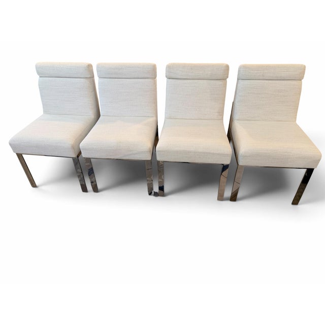Sleek Contemporary SophisticationBring pristine modern elegance to your dining space with this striking set of four...