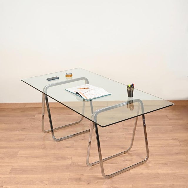 Minimalist and elegant pair of Italian Mid-Century trestles entirely crafted in chromed steel. This stylish set was...