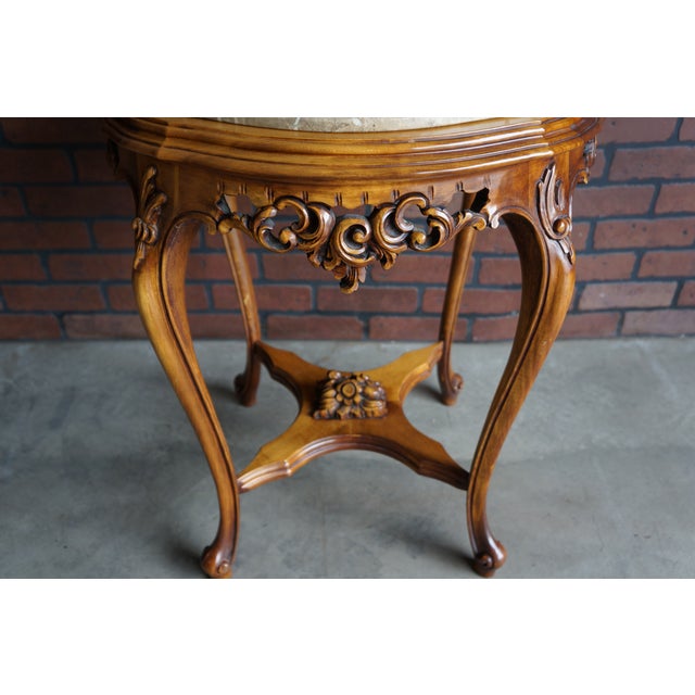 Incredible French style end table. Finely crafted in Italy featuring lovely carved details, sweet curvaceous cabriole legs...