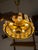 Luxurious Swedish glass art: This pendant lamp, crafted from gleaming brass and solid glass, was designed by renowned...