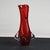 Elegant red Murano glass vase with spiral helix decorations and flaring, with a particular opening on the neck. Excellent...