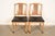 A gorgeous pair of Mid-Century Modern Hollywood Regency Chinoiserie side chairs or dining chairs In the manner of Henredon...