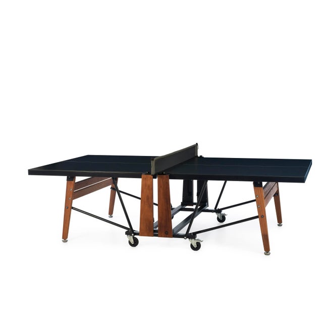 RS Folding Ping Pong table with black HPL top and iroko legs can be folded and stoREDwhen not in use and once opened is a...