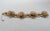 1950s goldtone wired flowers with beaded centers or birds nests with eggs link bracelet with box clasp and security chain....