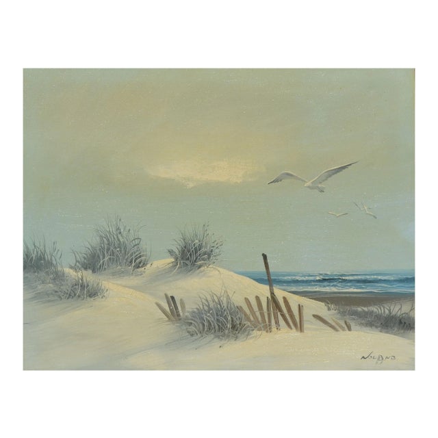 Peaceful landscape of sand dunes along a California beach with seagulls drifting overhead in a soft gray-blue sky, by a...