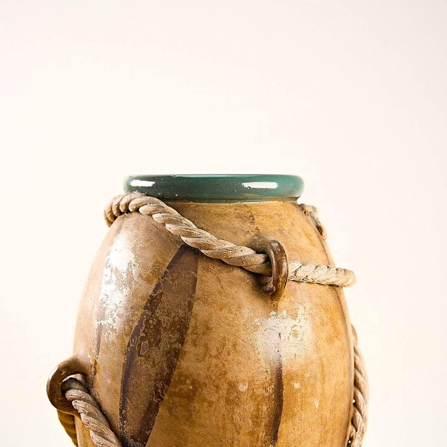 vintage glazed terracotta vase with strings attributed to the zaccag manufacture Height: 31 Diameter: 20 This piece is...