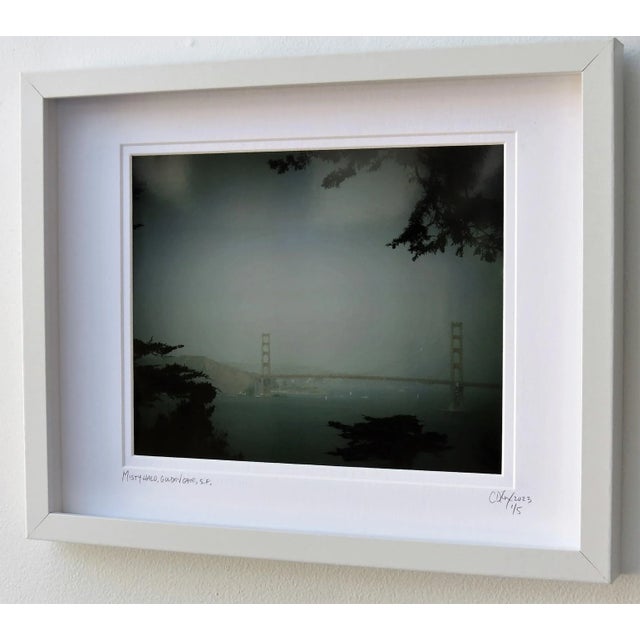"Misty Halo", Golden Gate Bridge with digitally enhanced color filters framed and matted under glass. 12" x 15". Size...