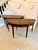 A fine large pair of antique mahogany demilune console tables each table features a beautifully figured mahogany top with...