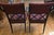 These 1960s Henredon dining chairs designed by Dorothy Draper feature an ebonized black finish with gilded accents....