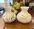 Offering a pair of blown glass vases from Italy with swirls of color and gold flecks. Perfect to display anywhere!