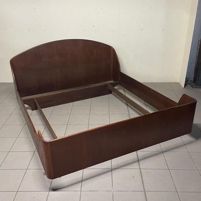 The "Model LT 37" double bed, an icon of mid-century Italian design, designed by architects Franco Albini and Franca Helg...