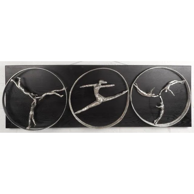 This beautiful contemporary modern wall art features a unique Olympic style design with three circles displaying athletic...