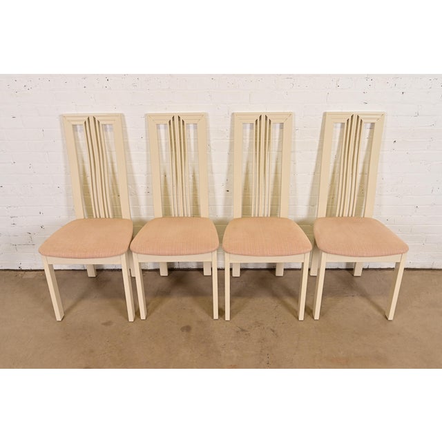 A sleek and stylish set of four Italian Modern or Postmodern slatted high back dining chairs In the manner of Pietro...