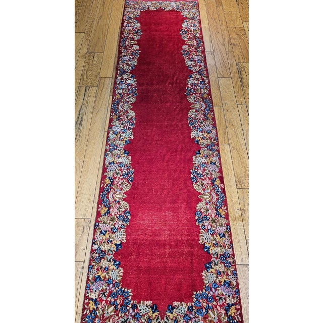 "This exquisite Vintage Persian Kerman Runner showcases the elegance and craftsmanship of southern Persia’s rich weaving...