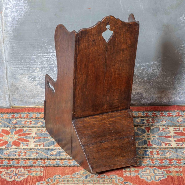 A good early example of a child's rocker in the style of a lambing chair. Made from oak and showing an attractive patina....