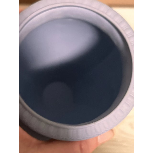 Classic and elegant Wedgwood Jasperware vase in the iconic pale blue finish, featuring a finely detailed white relief of...